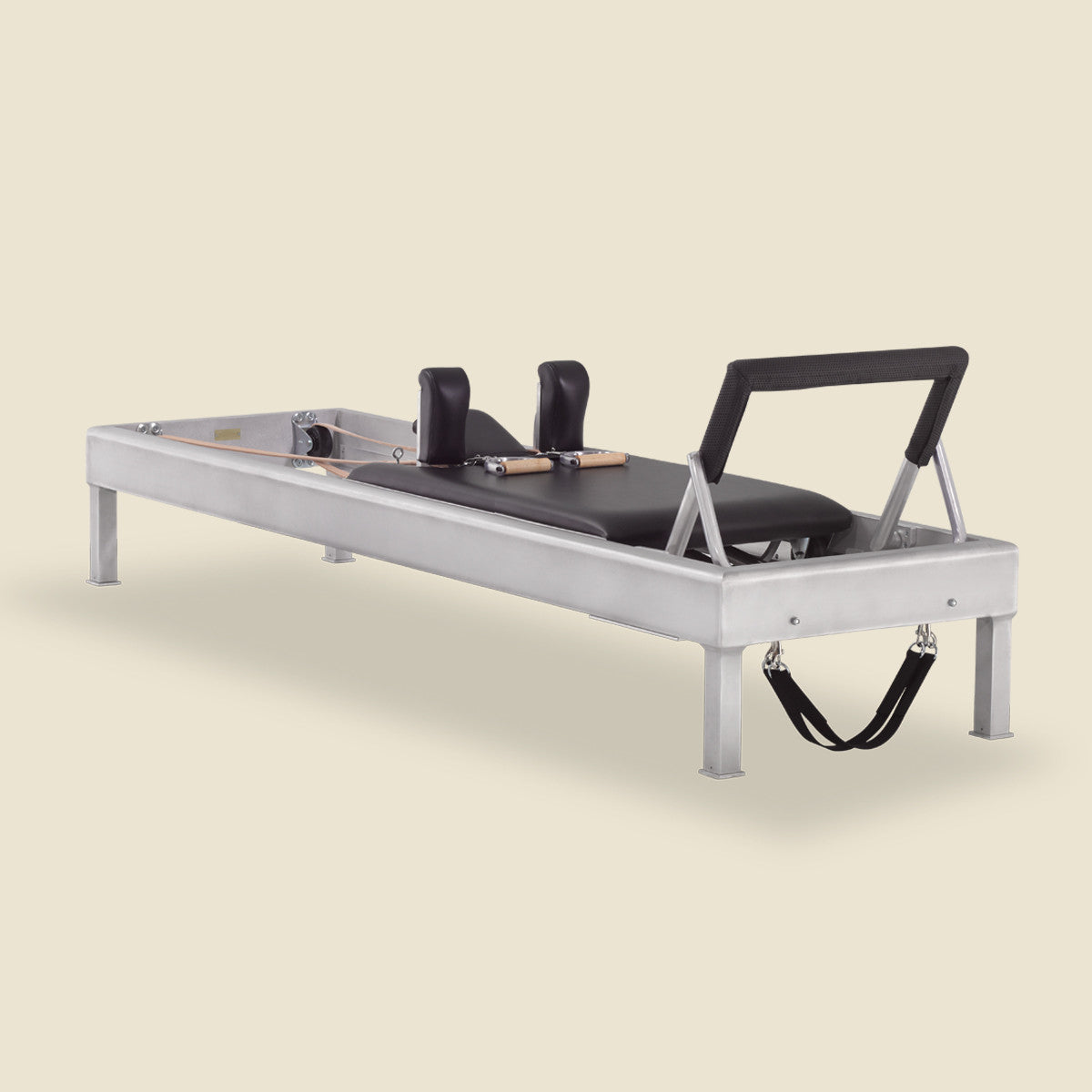 Close-up view of metal springs and hardware components on a pilates reformer machine