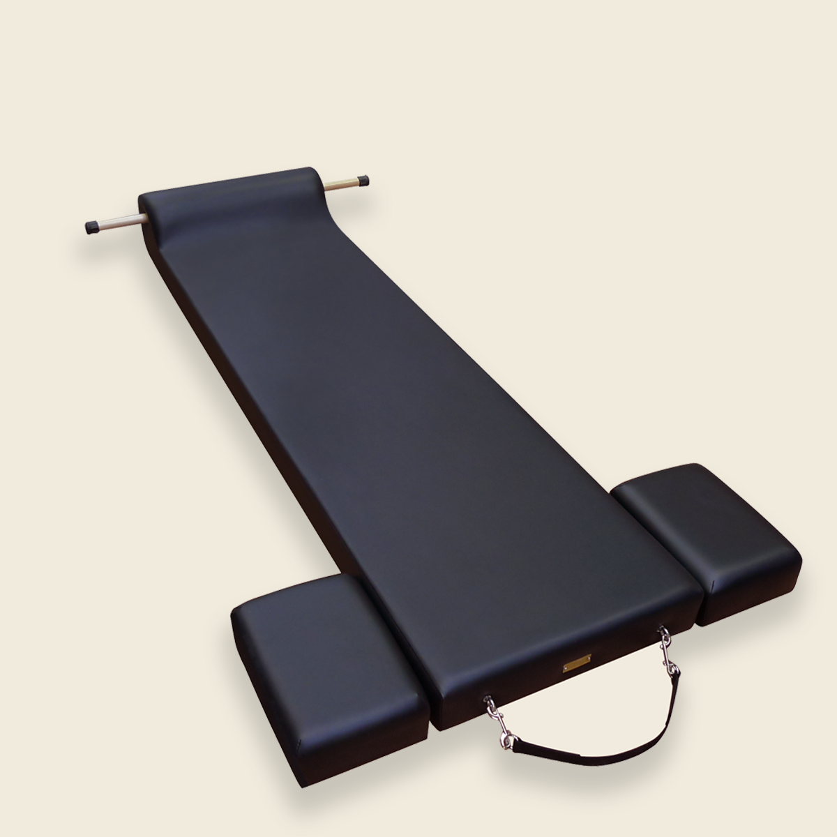 Black metal pilates wall unit tower with adjustable springs and exercise handles mounted on wall